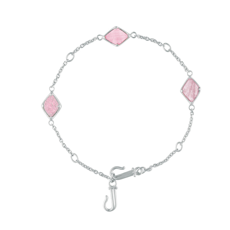 A flat-lay image of Juraster's Sterling Silver Rose Quartz Adjustable Bracelet, Three Wishes, crafted from Fairmined sterling silver and hand-cut rose quartz, with adjustable clasp.