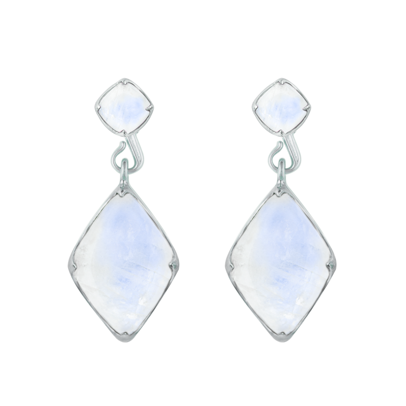 A front-view image of a pair of Juraster’s 9ct White Gold Rainbow Moonstone Earring Studs and Charms, Adventure, crafted from Fairmined white gold and a hand-cut moonstone attached to matching studs.