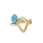 A front-view image of Juraster’s 9ct Gold Stacking Ring in Persian Blue Turquoise, Lodestone, crafted from Fairmined 9ct yellow gold and a hand-cut turquoise gemstone, stacked on top of a yellow gold diamond-shaped ring.