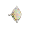 A side-view image of Juraster’s 14ct white gold transformable ring-pendant with opal, rainbow gemstones & diamonds, Selkie 2, crafted from Fairmined white gold, precious Australian opal, hand-cut gemstones and conflict-free diamonds.