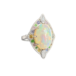 A side-view image of Juraster’s 14ct white gold transformable ring-pendant with opal, rainbow gemstones & diamonds, Selkie 2, crafted from Fairmined white gold, precious Australian opal, hand-cut gemstones and conflict-free diamonds.