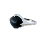 A side-view image of Juraster's Sterling Silver Black Onyx Statement Ring, Talisman, crafted from Fairmined sterling silver and hand-cut black onyx.