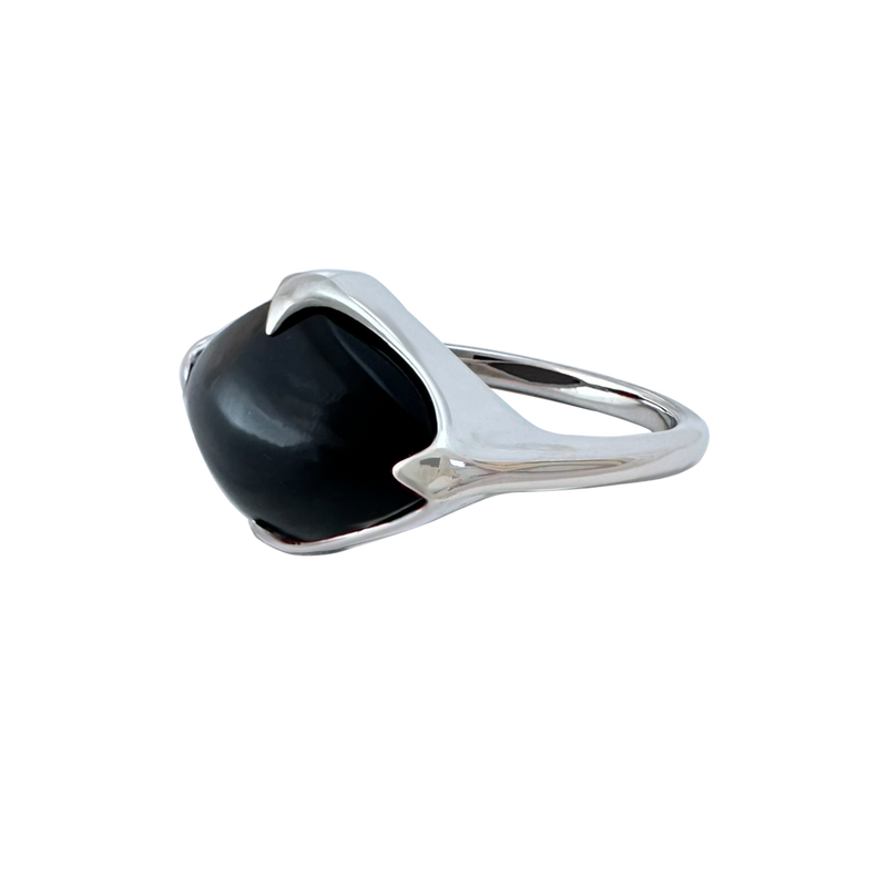 A side-view image of Juraster's Sterling Silver Black Onyx Statement Ring, Talisman, crafted from Fairmined sterling silver and hand-cut black onyx.