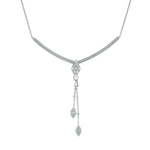 A flat-lay image of Juraster’s 9ct White Gold Diamond Adjustable Necklace, Voyager, crafted from Fairmined 9ct white gold and conflict-free diamonds, with a white gold diamond encrusted tassel pendant.