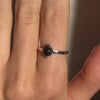 A video of a model wearing Juraster’s Sterling Silver Stacking Ring in Black Onyx, Lodestone, crafted from Fairmined 9ct sterling silver and a hand-cut black onyx gemstone.