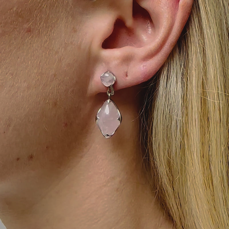 A video of a model wearing Juraster’s Sterling Silver Rose Quartz Earring Charm, Adventure, crafted from Fairmined sterling silver and a hand-cut rose quartz attached to a matching earring stud.